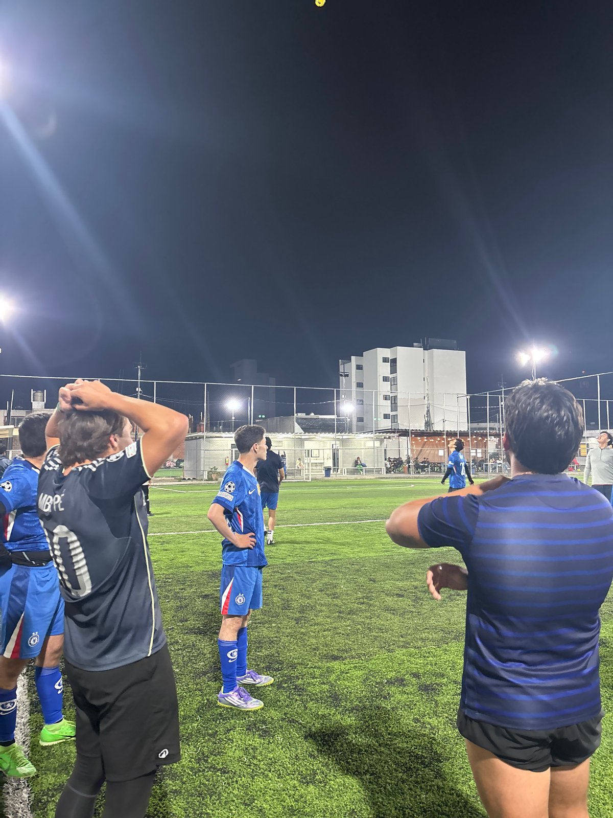 Illuminated soccer field captured at night in Tlaxcalancingo