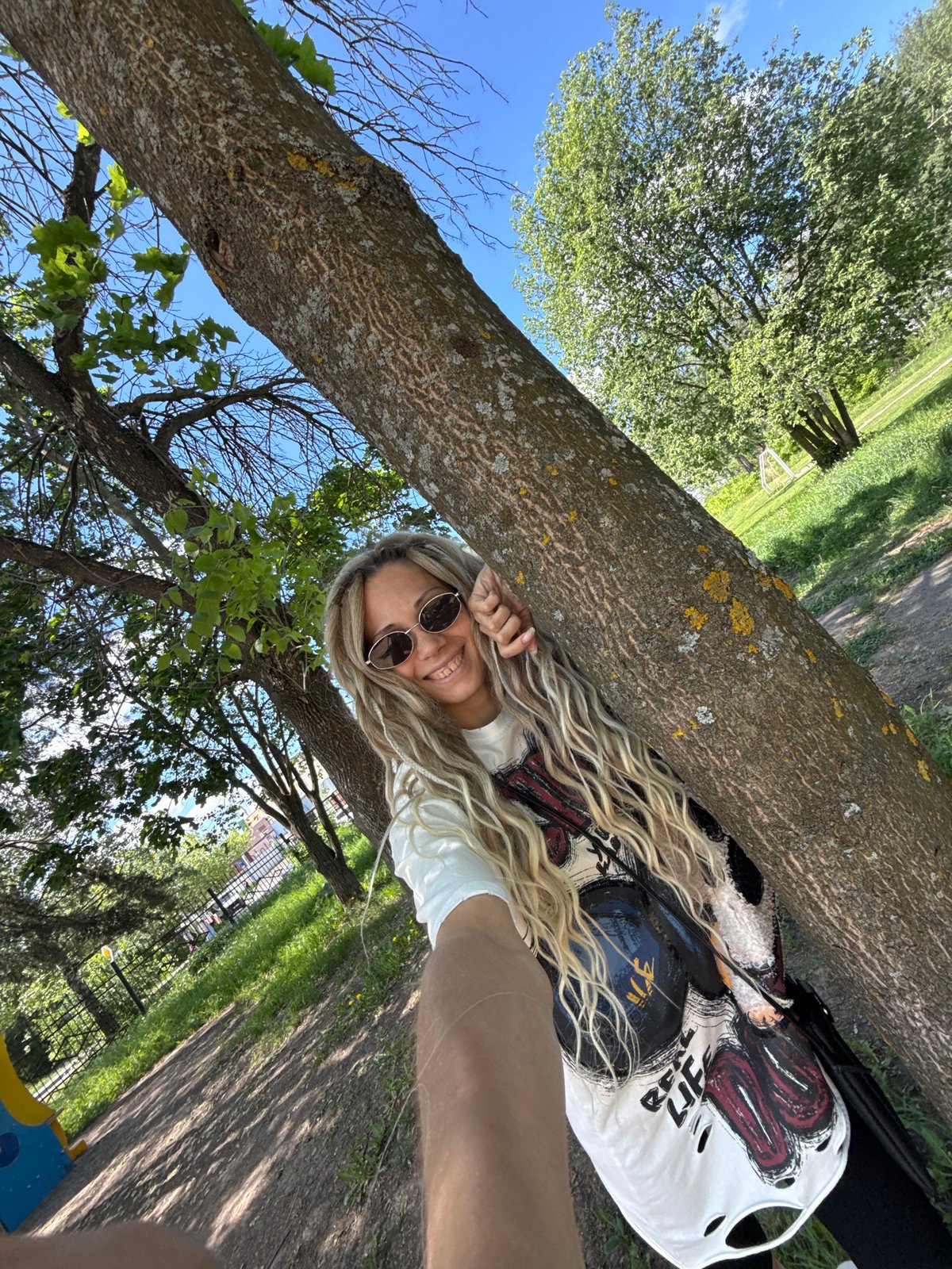 Woman photographed in casual moments in Rusanovo park and indoors