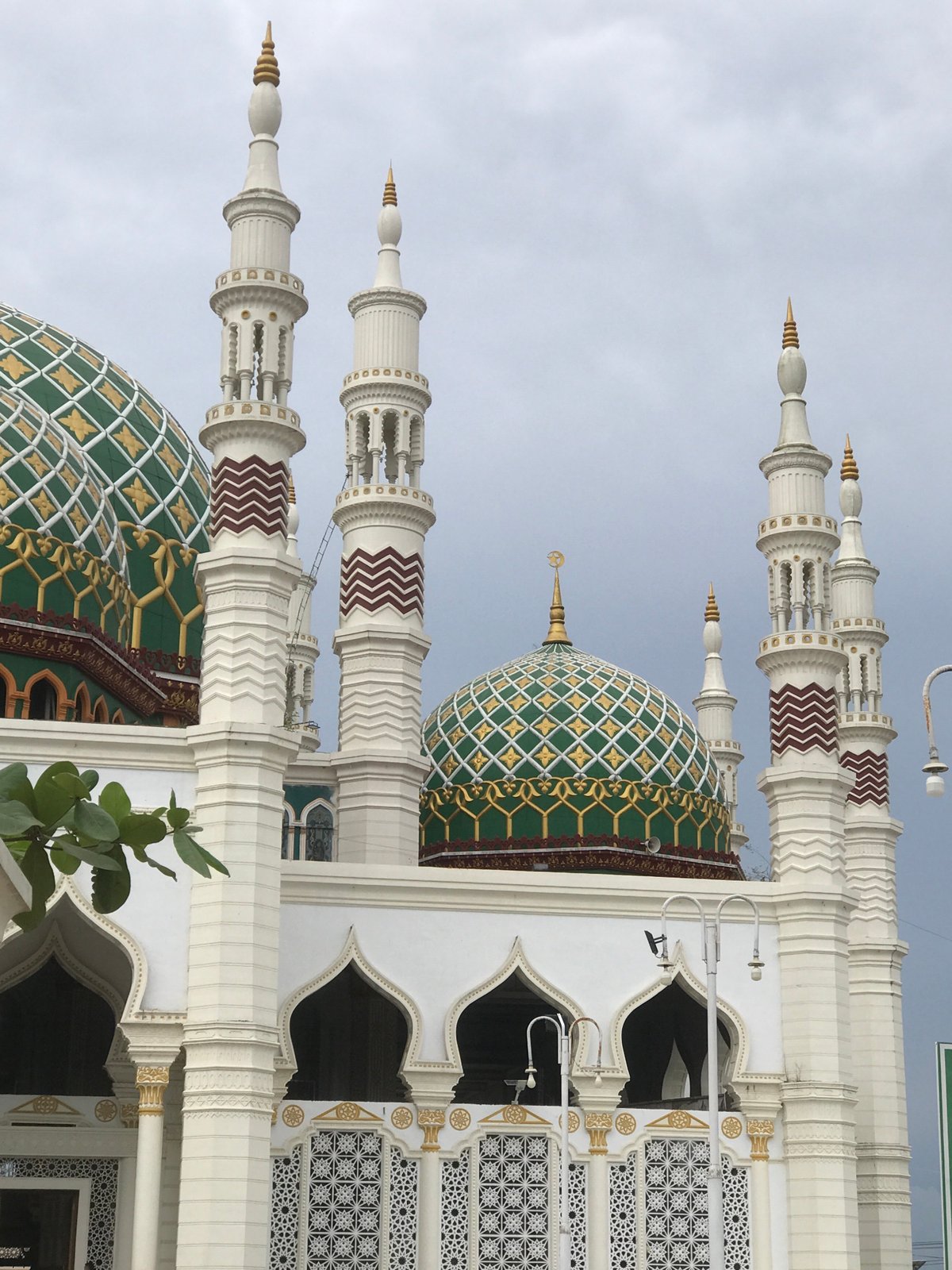 Mosque with ornate domes photographed in Kotapantonlabu, Indonesia
