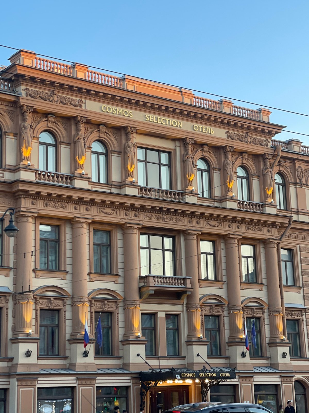 Tourist documents springtime walk through Saint Petersburg landmarks