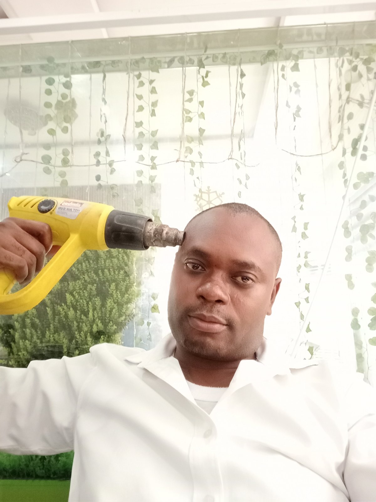 Man documented in multiple indoor scenes in Gwarinpa, Nigeria