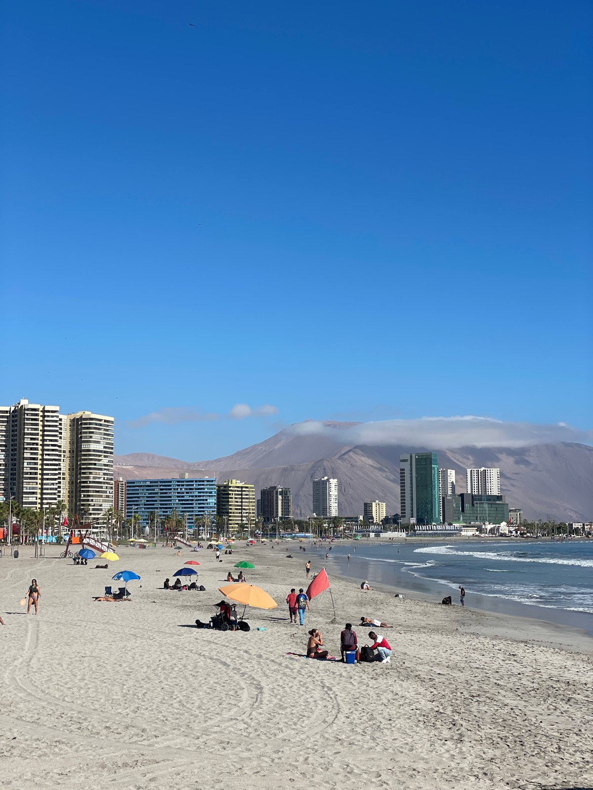 Beachgoers enjoy sunny evening at Iquique coastal area