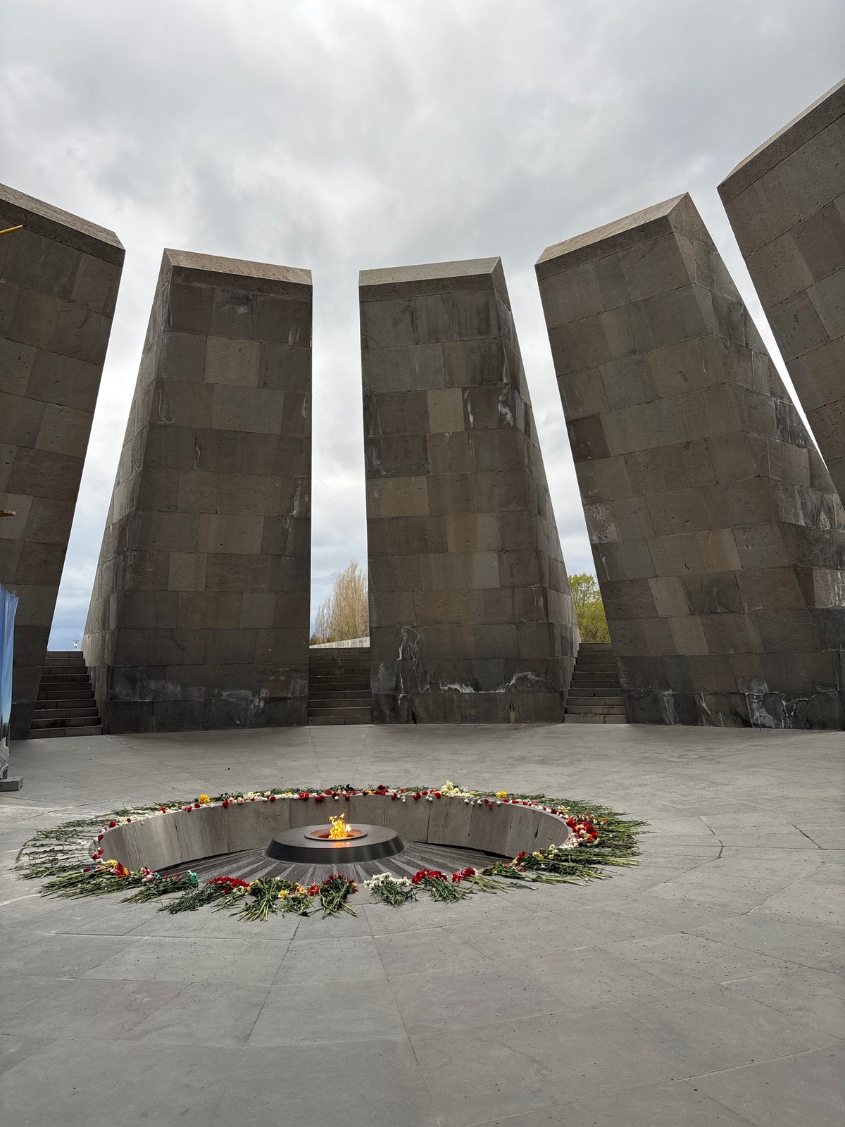Visitor documents Armenian Genocide Memorial eternal flame in Yerevan