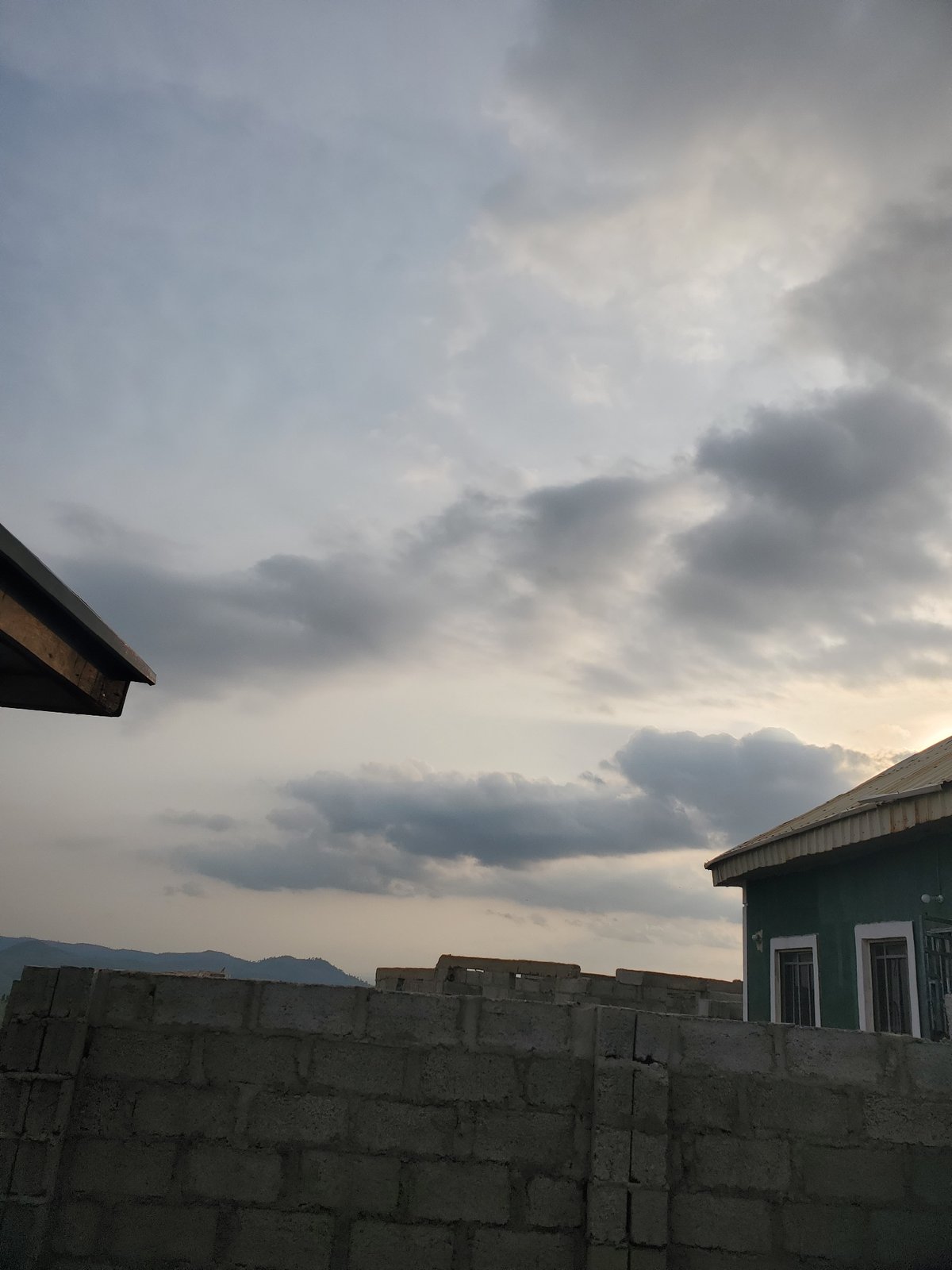 Suleja outskirts at dusk: construction site meets open landscape