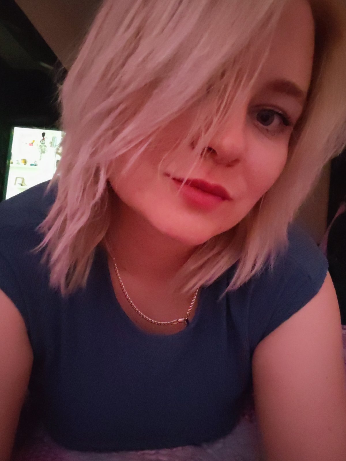 Woman takes casual selfies with pet dog in Izhevsk home
