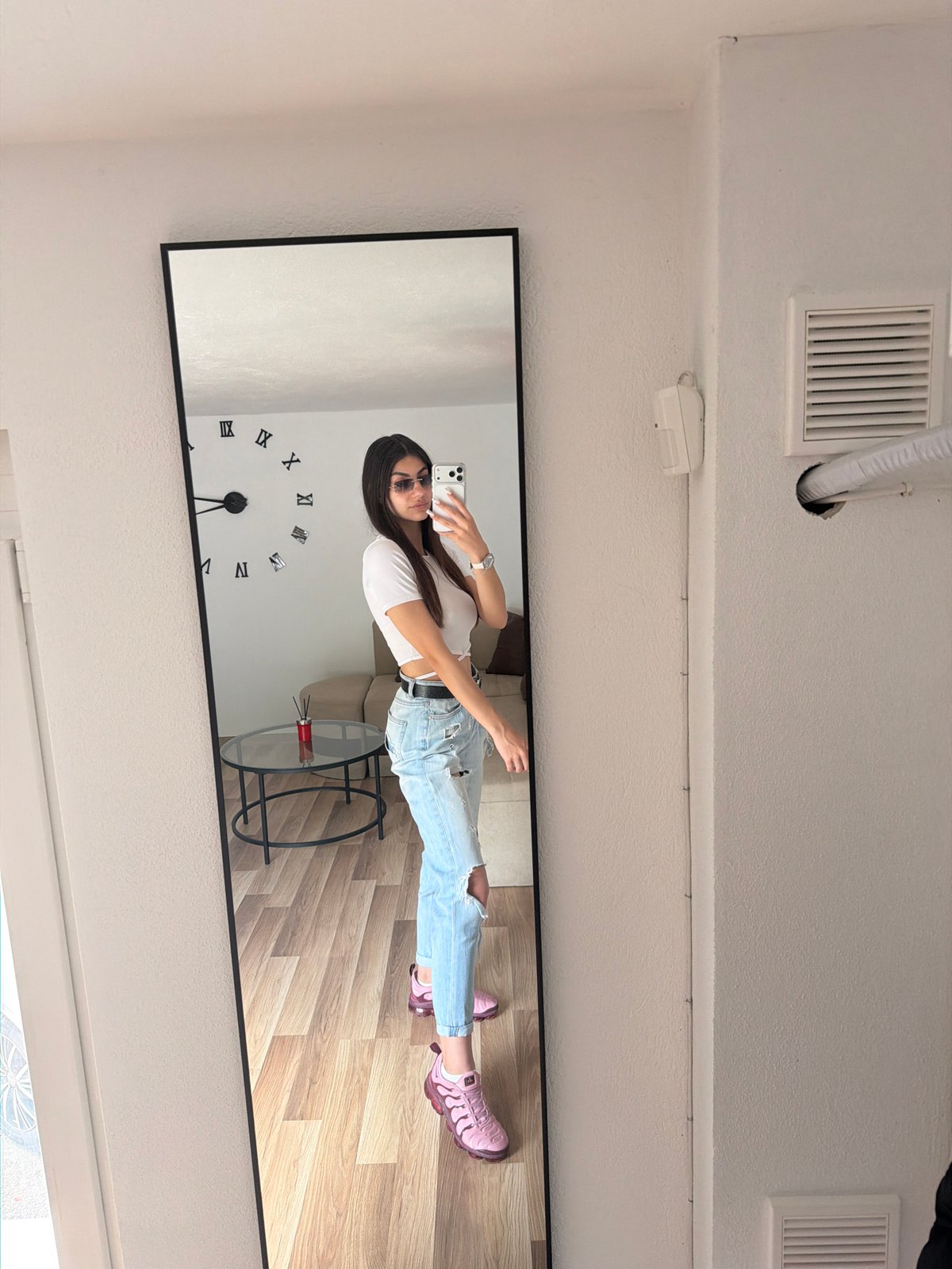 Woman Takes Mirror Selfies in Gabrovo Interior Space