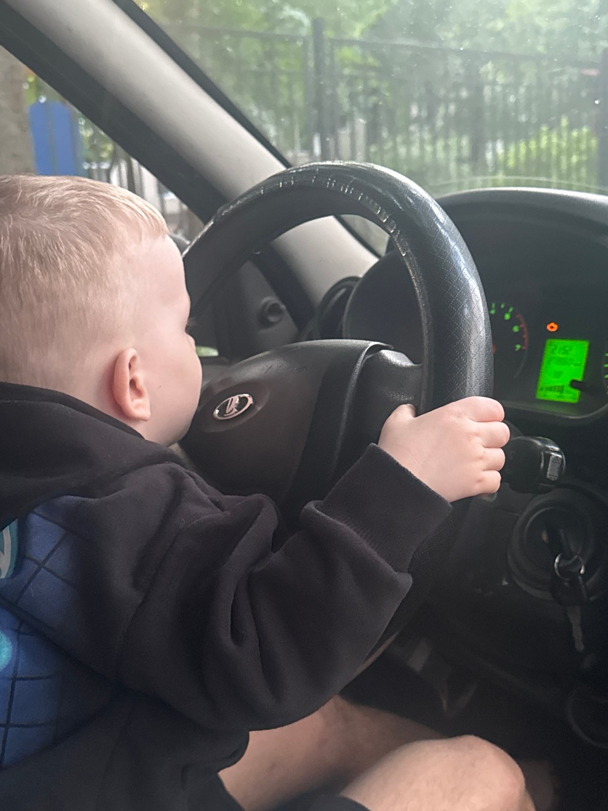 Father and child share driving moment in Saint Petersburg car
