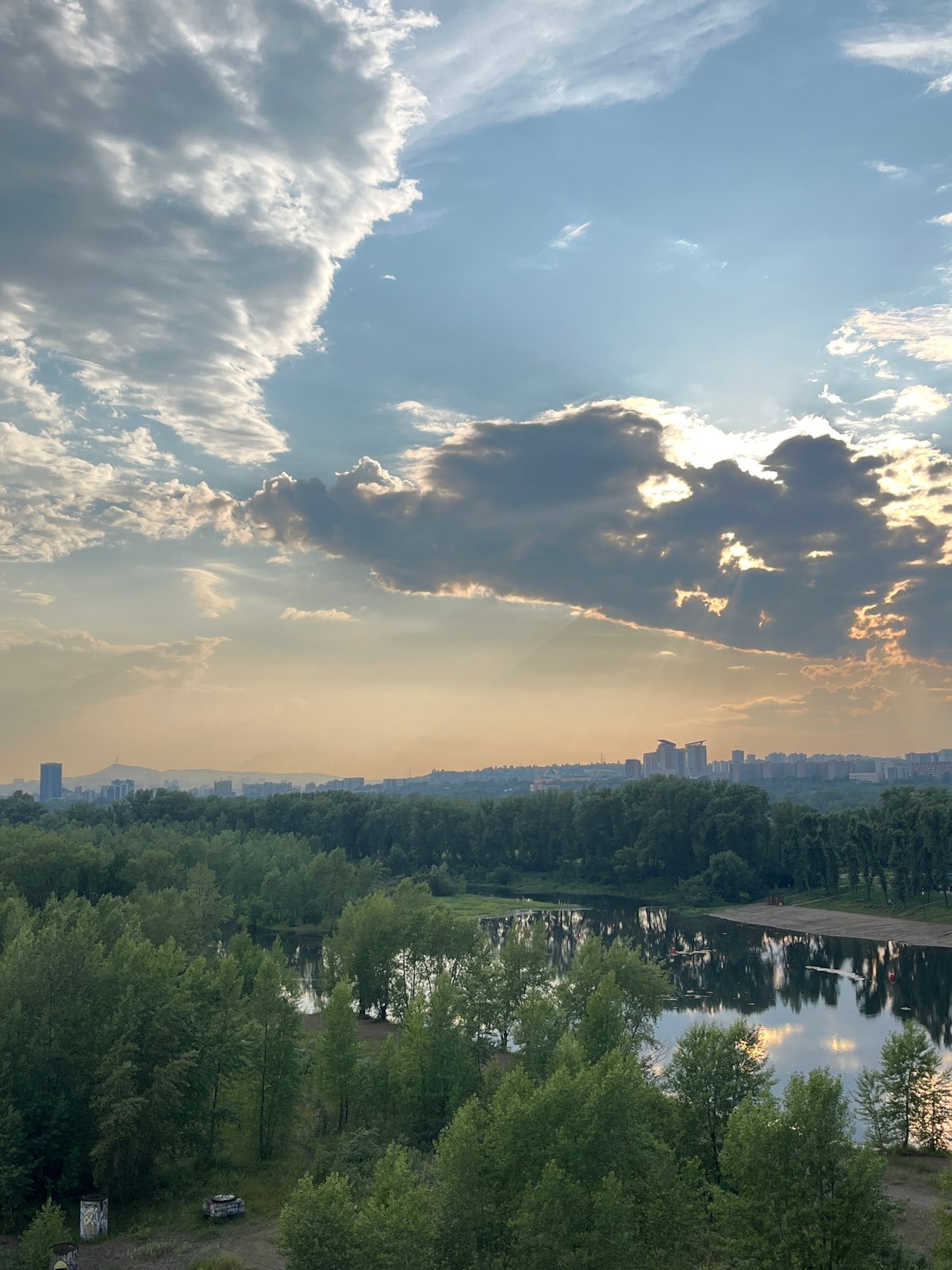 Exploring Krasnoyarsk's Yenisei riverfront on a stormy summer afternoon