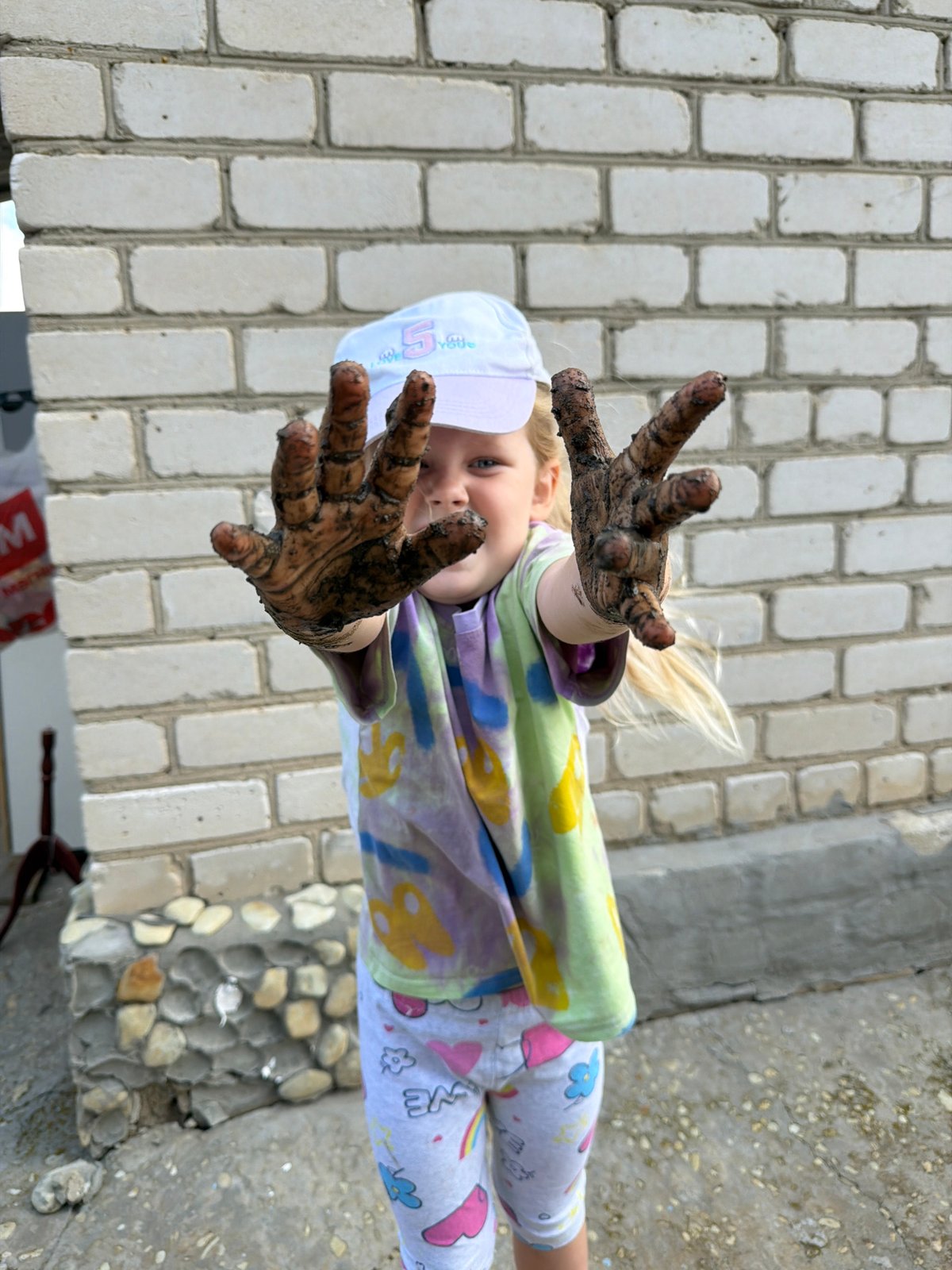 Summer morning play and garden flowers in Kamyshin, Russia