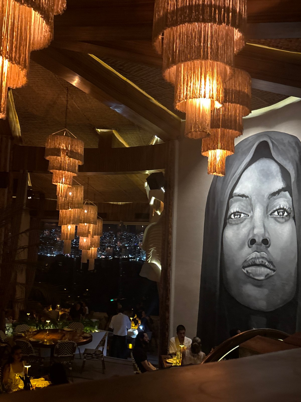 Acapulco restaurant interior captured featuring distinctive woven light fixtures