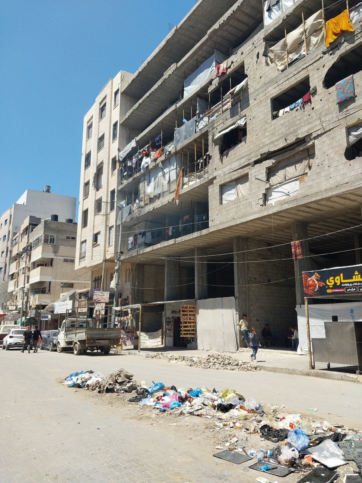 Daily life scenes documented across Gaza City streets and restaurants