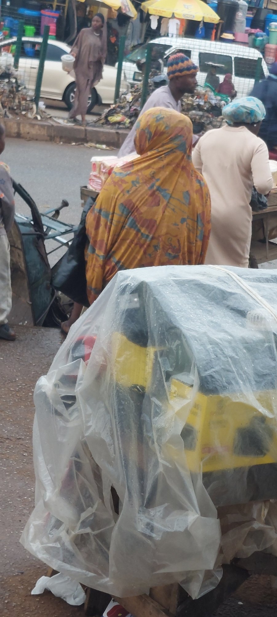 Busy street market activity throughout Bukuru, Nigeria afternoon