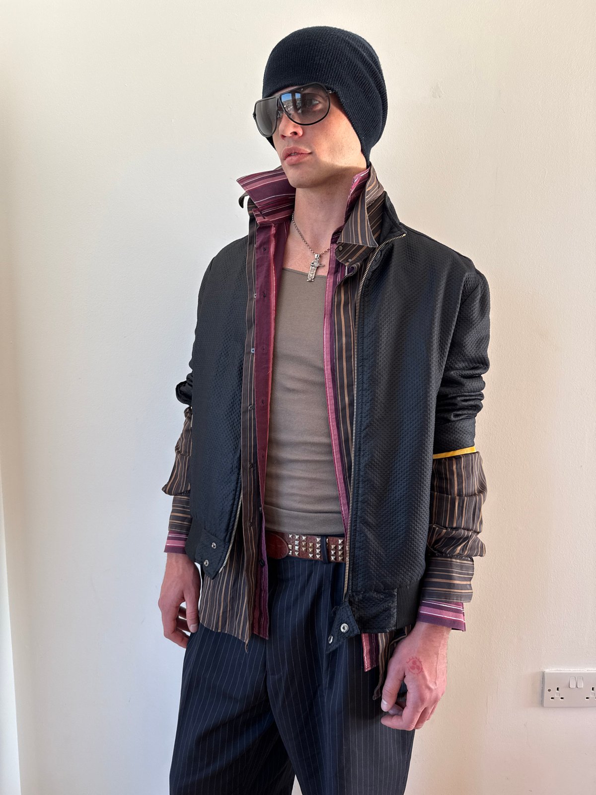 Young person photographed indoors in London apartment setting