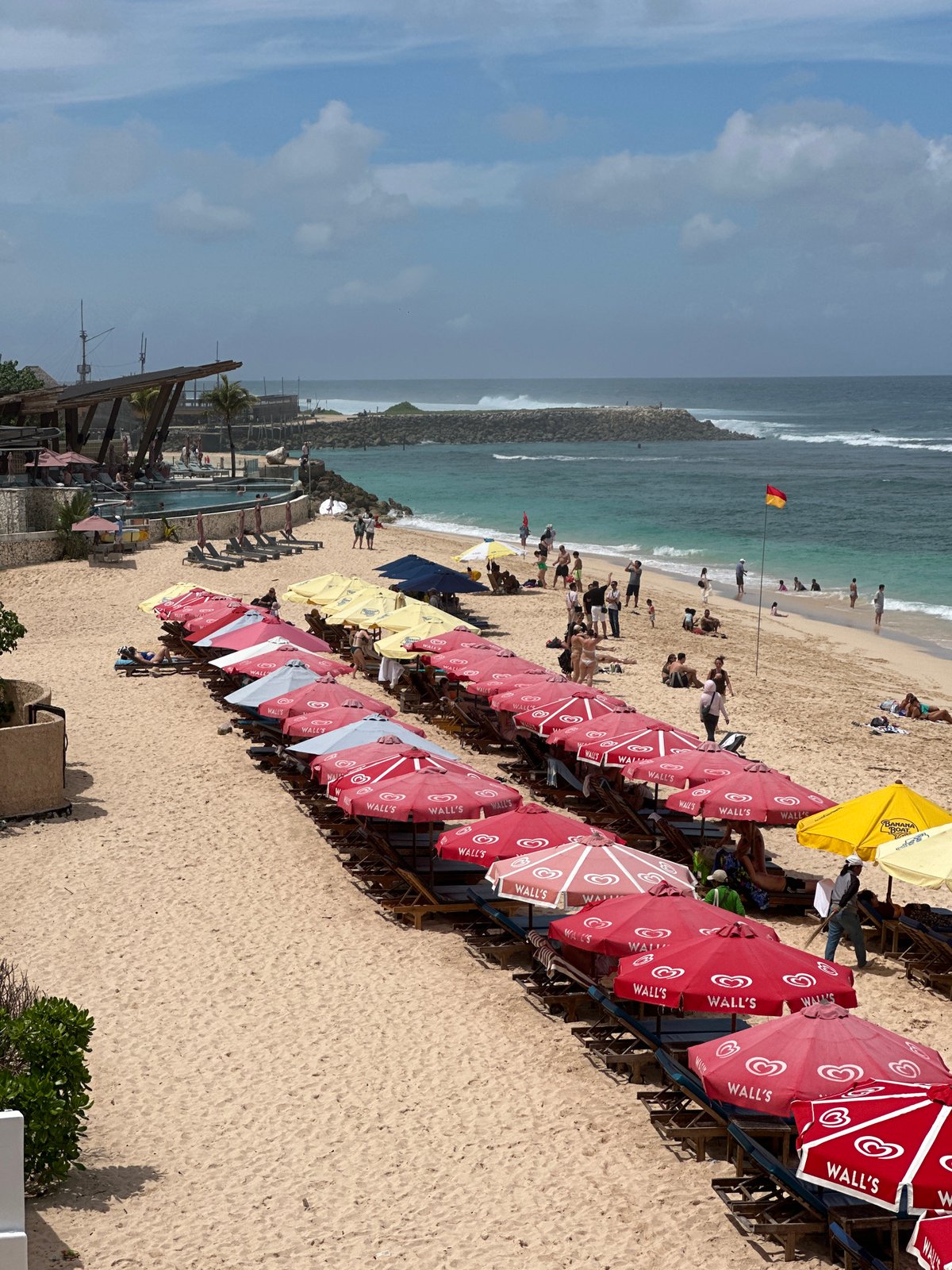 Bustling beach scene captured from elevated view in Kuta Selatan