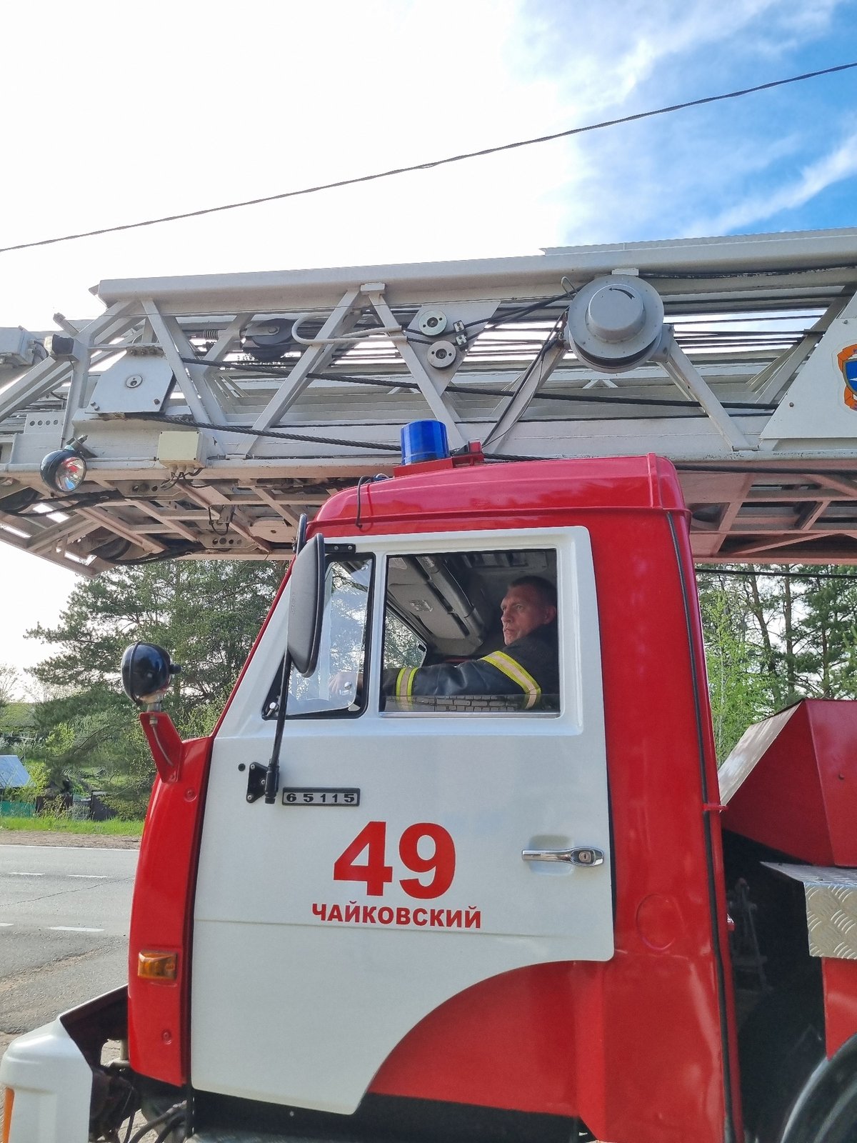 Fire truck responds in Chaikovsky as boy poses indoors