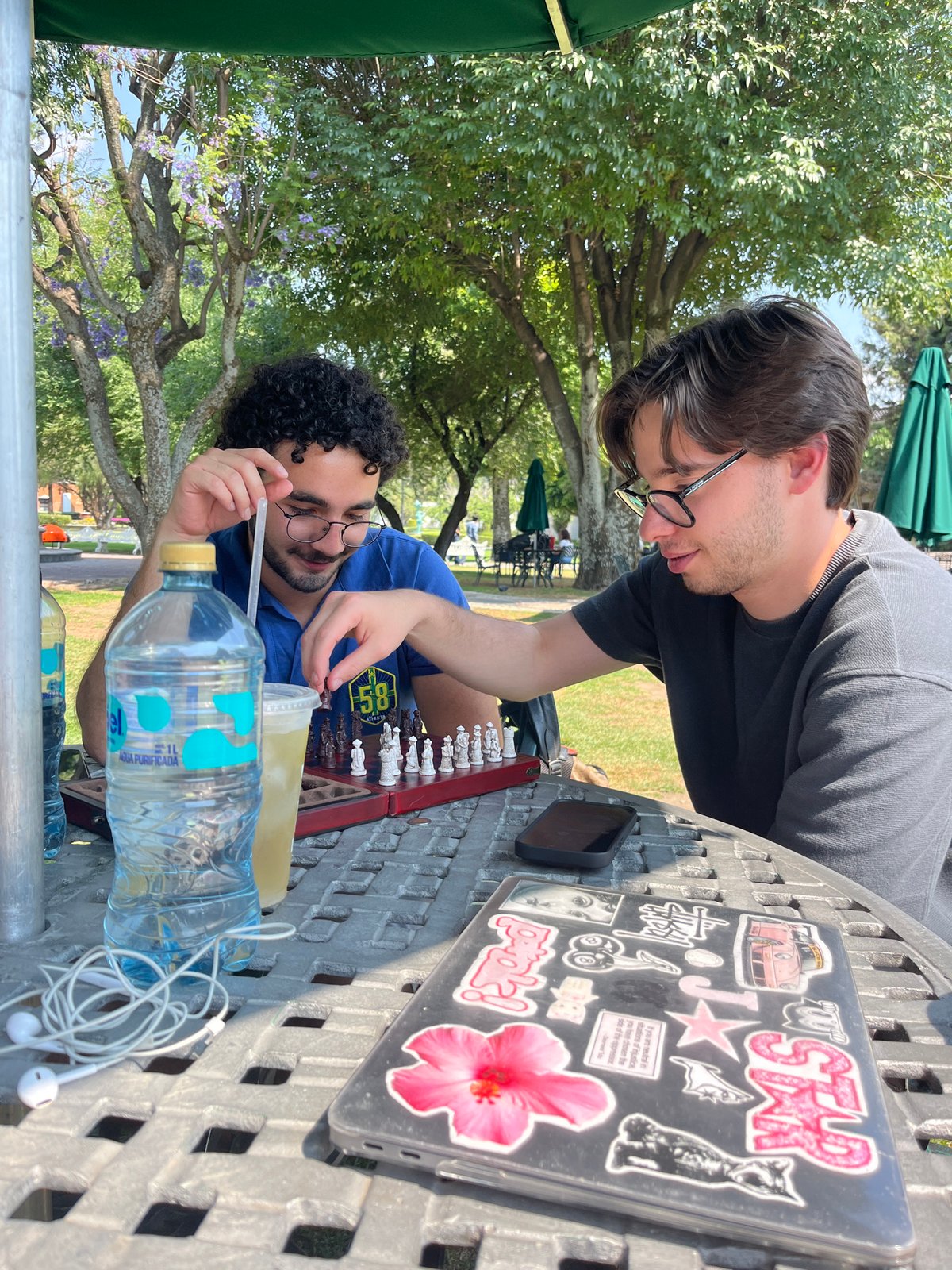 Two men play chess outdoors in San Andrés Cholula