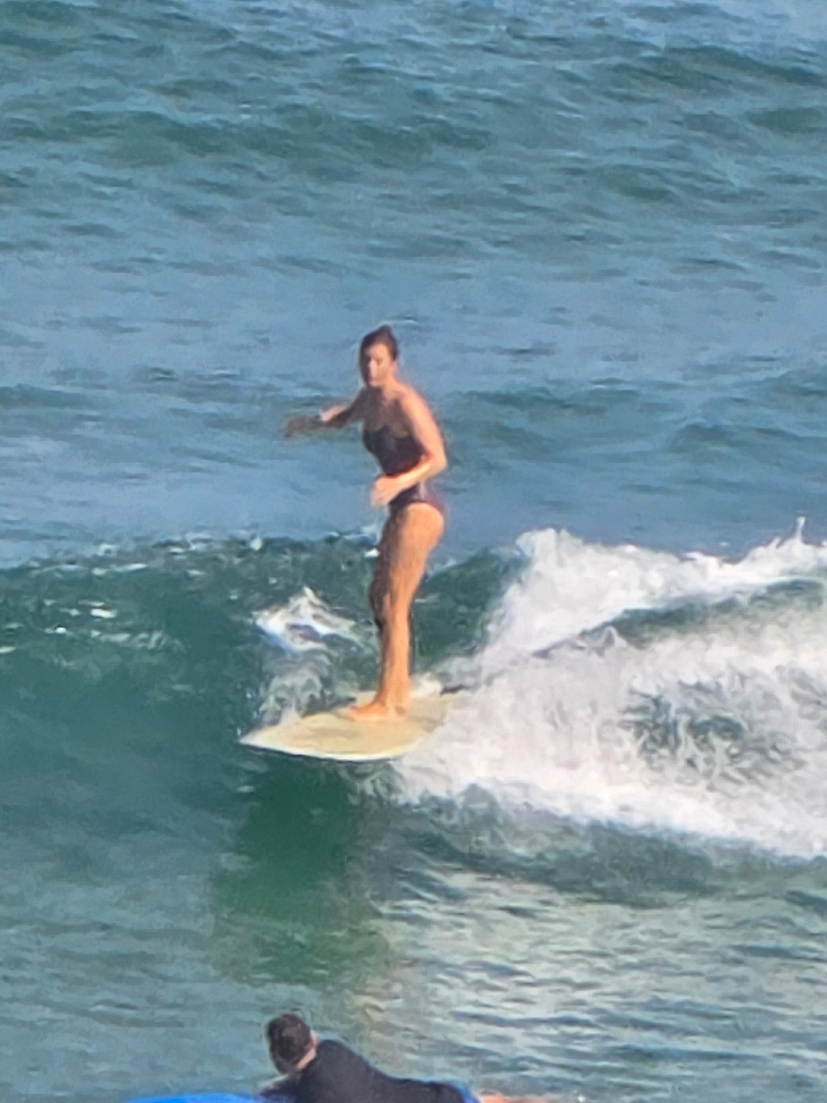 Early morning surfing and diving activity observed in Tel Aviv waters