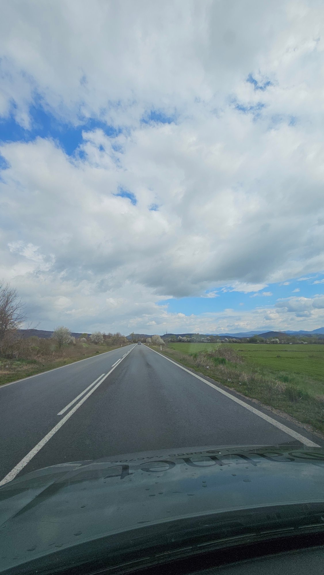 Vehicle travels paved road in Vasil Levski, Bulgaria