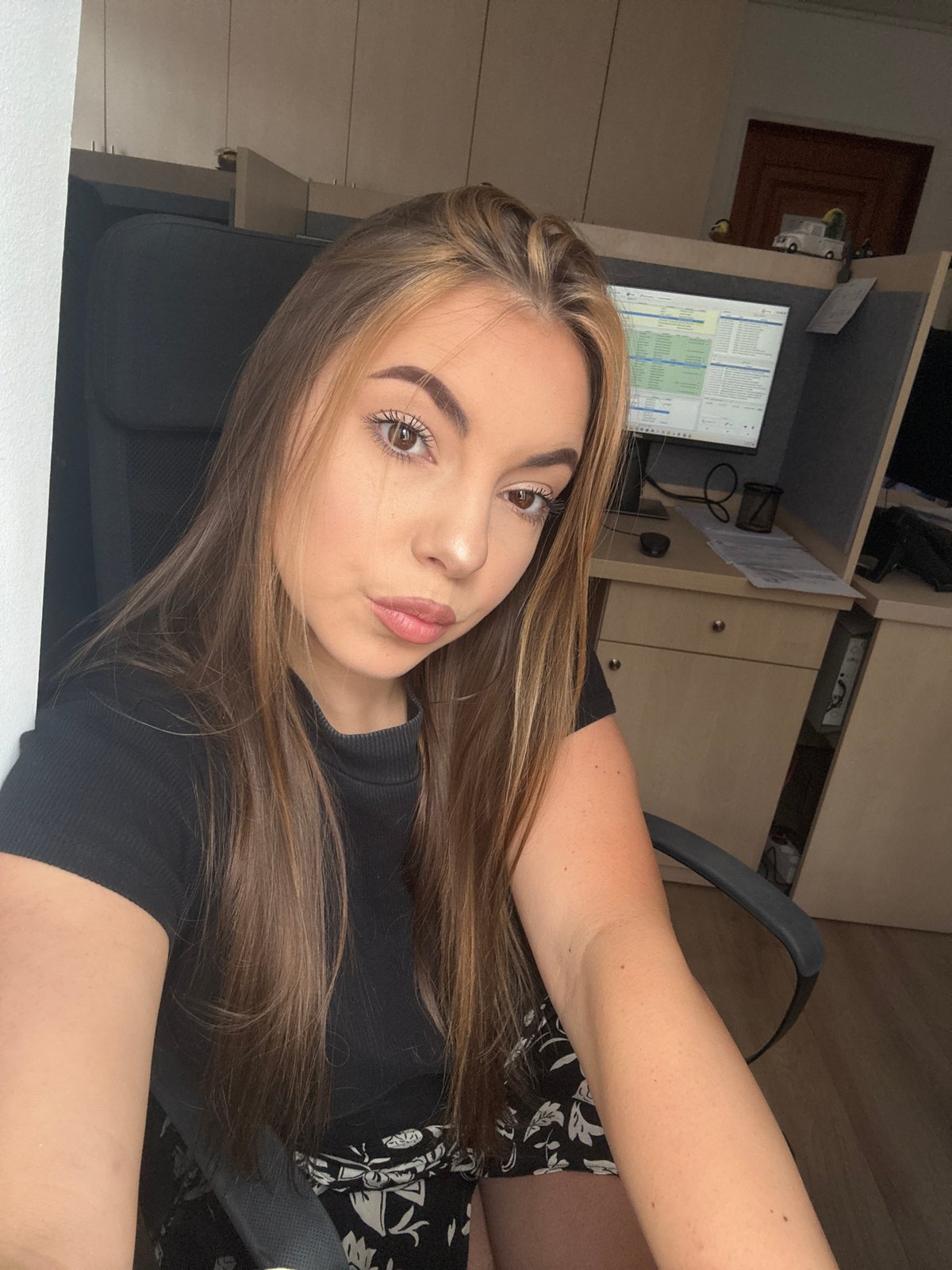Woman documents office selfie session in Sofia
