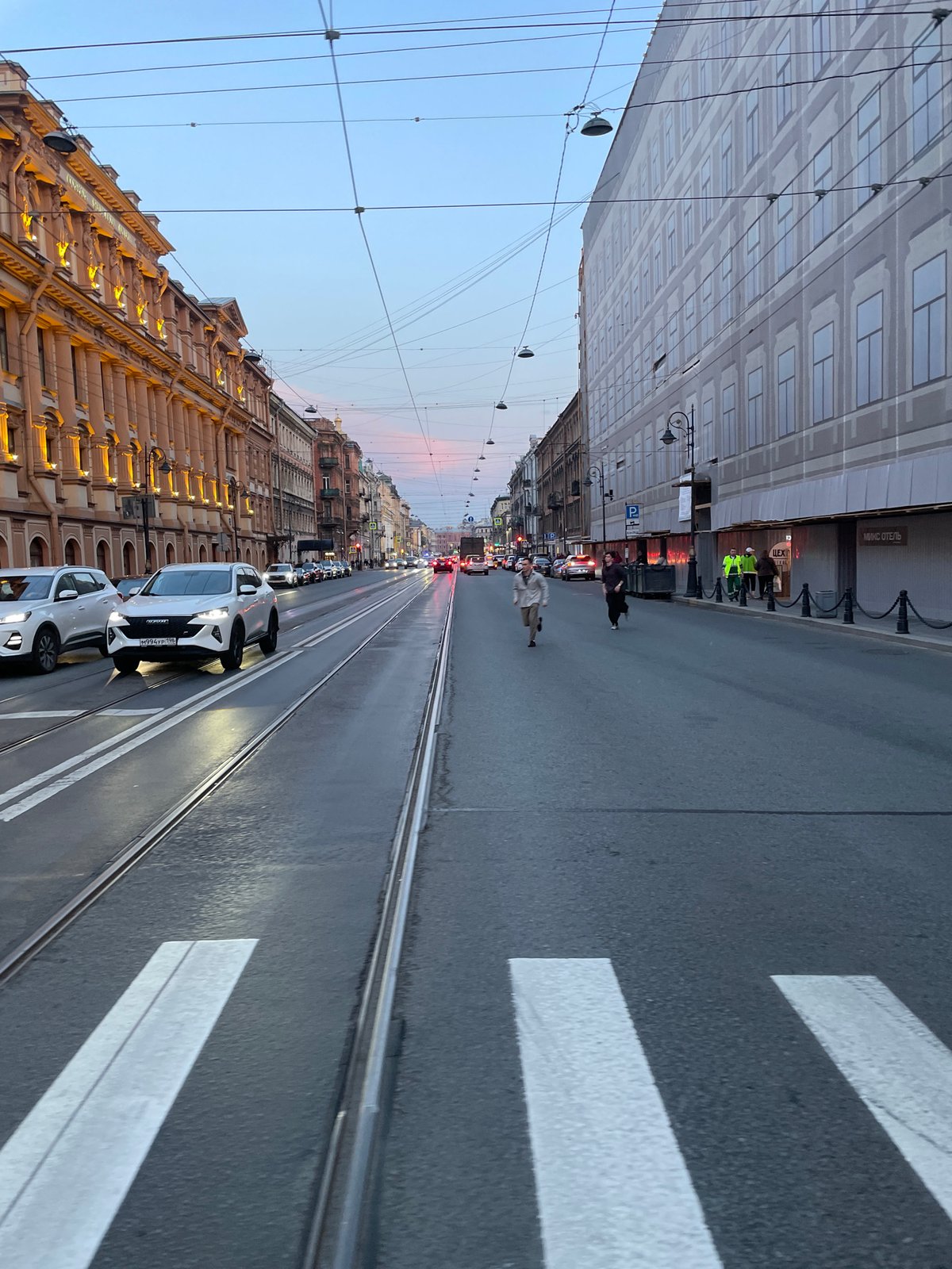 Evening street life documented across central Saint Petersburg