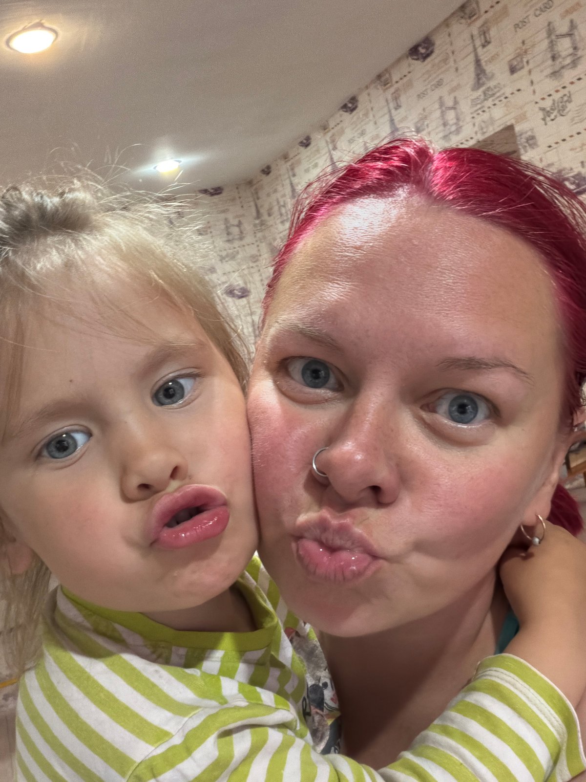 Indoor moments: selfie and cat feeding captured same location