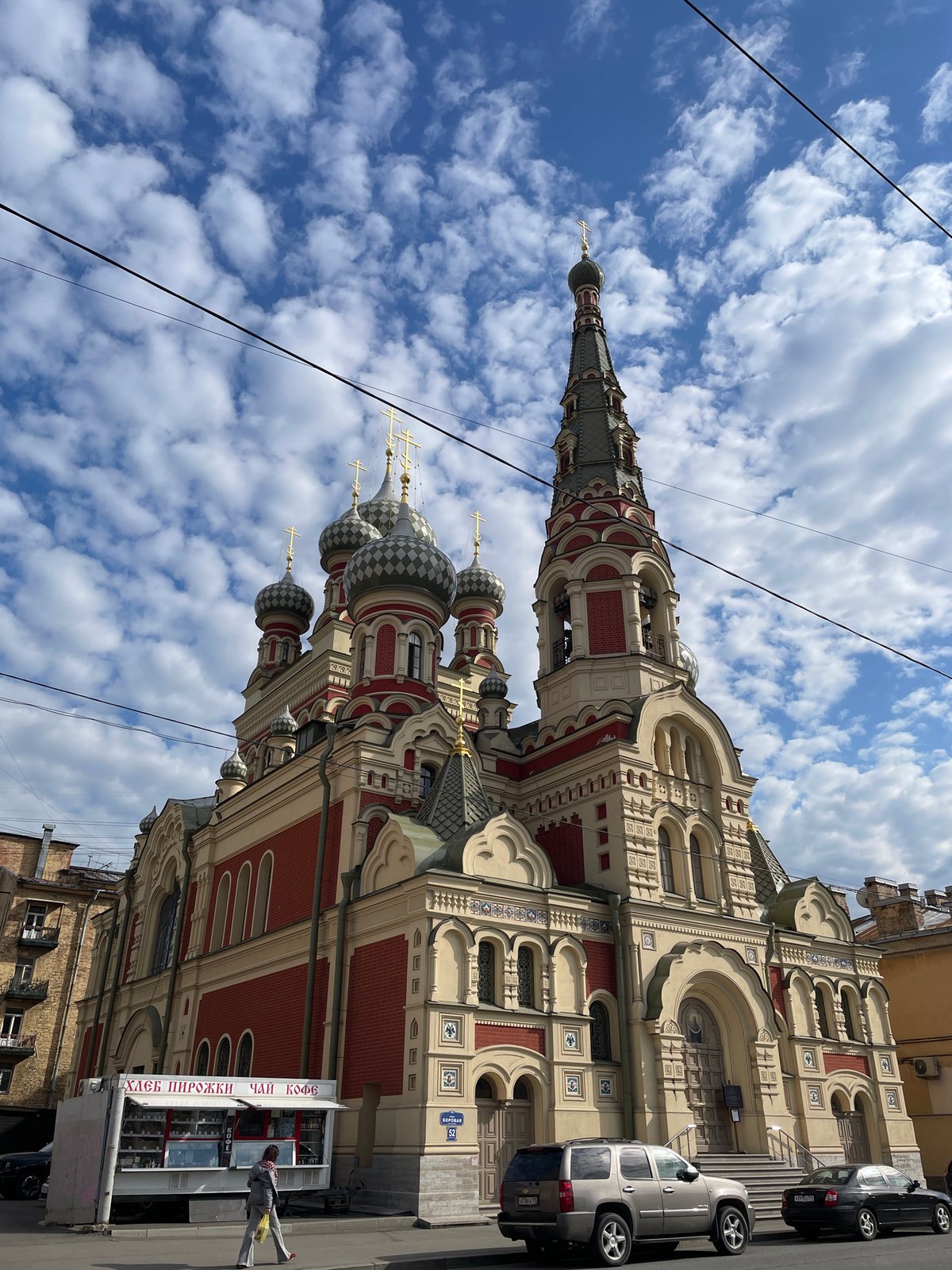 Tourist photographs ornate Orthodox church in Saint Petersburg