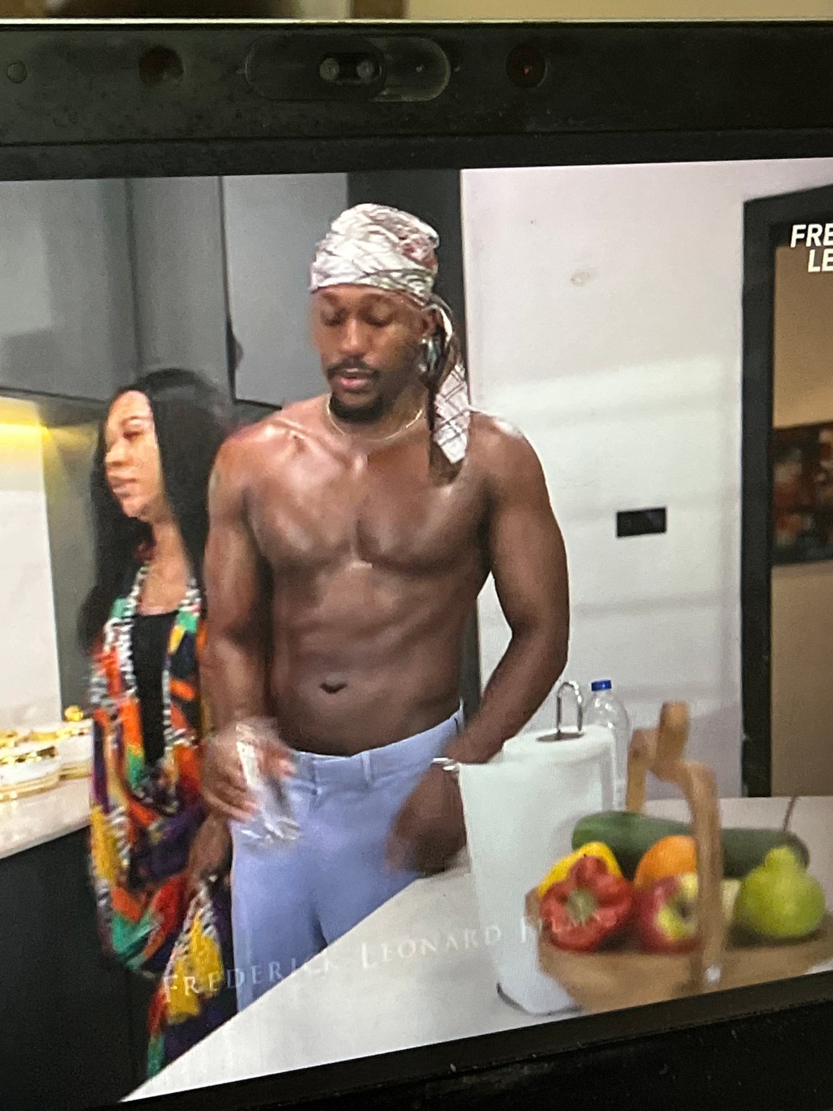 Man watches Nigerian film 'The Kinsman' on devices in Abuja