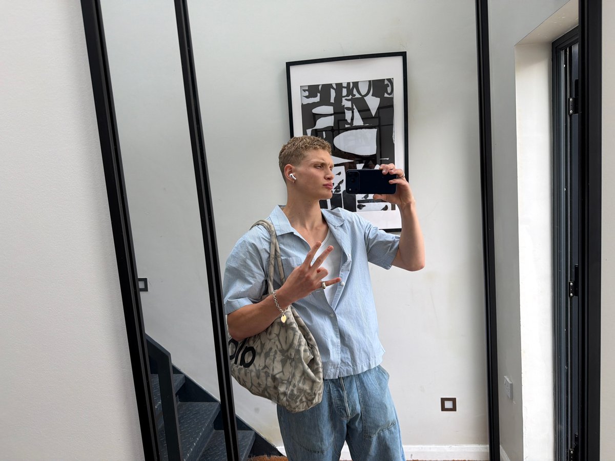 Mirror selfie in modern London interior space