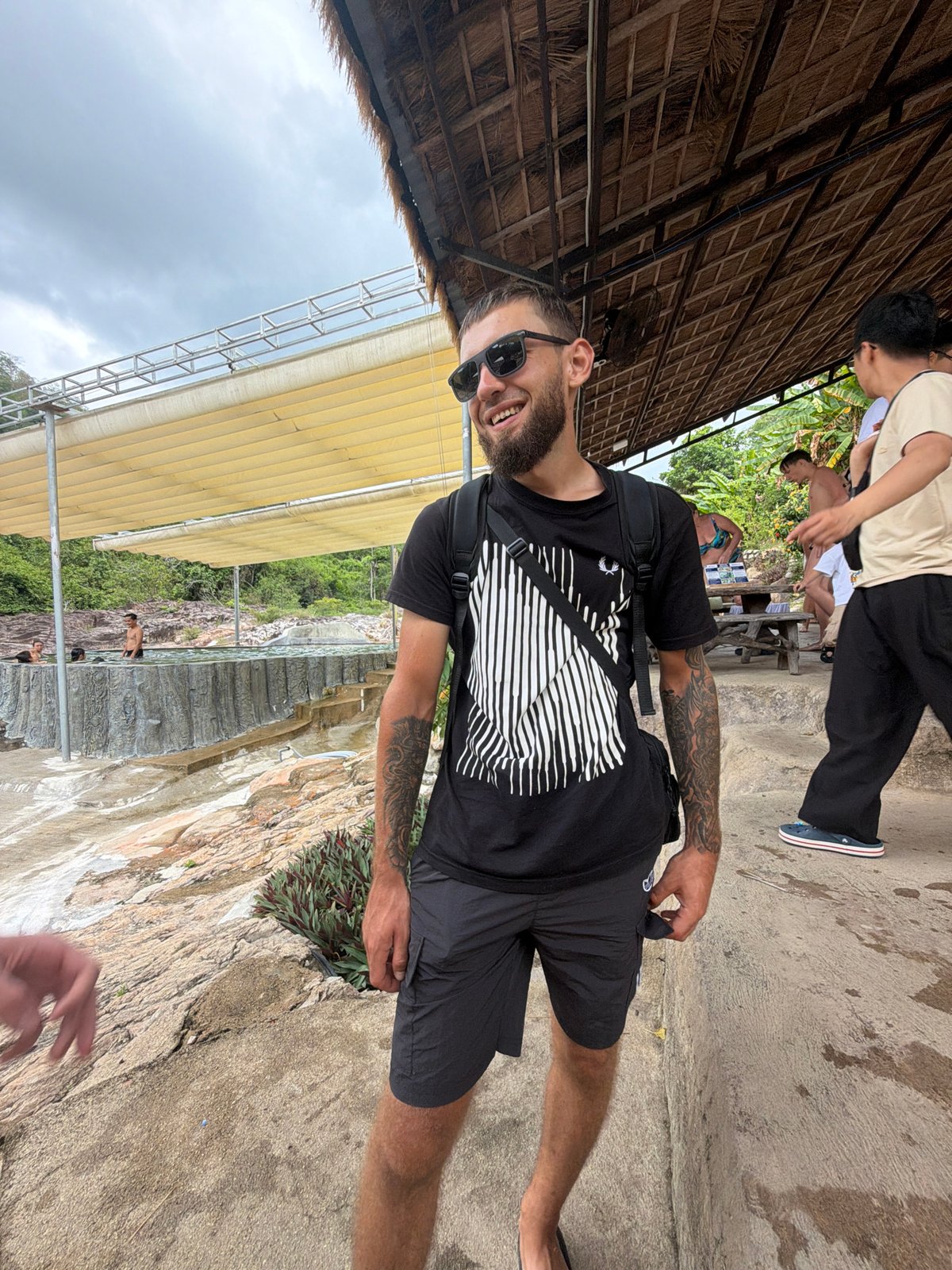 Tourists enjoy waterfall resort activities in Khanh Vinh, Vietnam