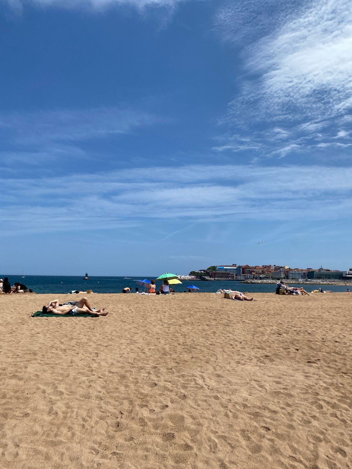 Weekend beach activity documented in Gijón, Spain