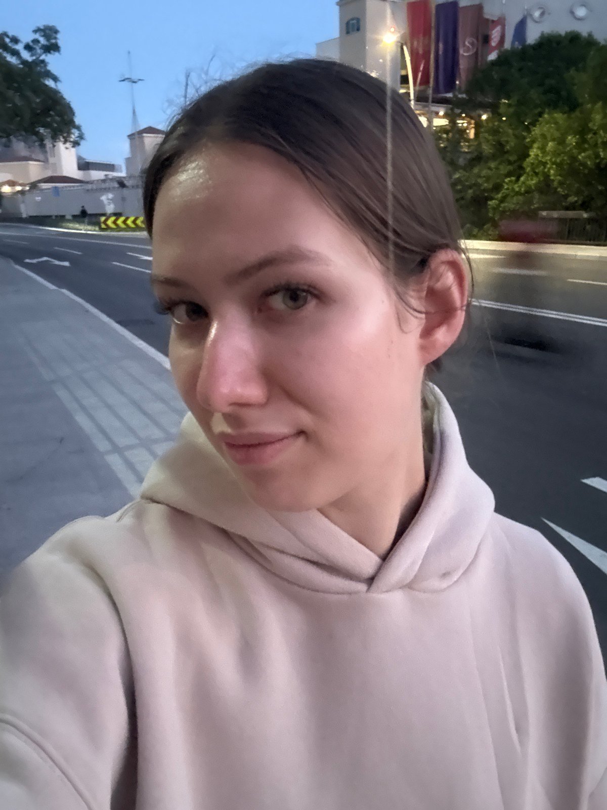 Woman films evening selfie walk in Boreti, Montenegro
