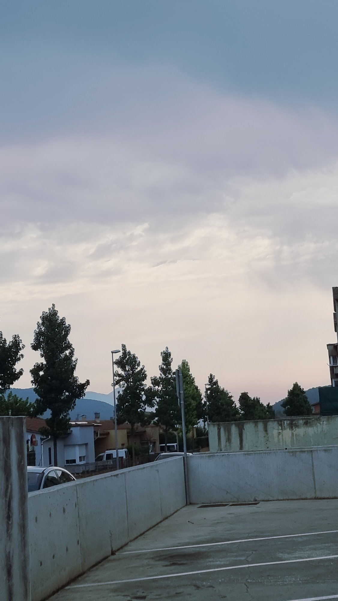 Street-level views of Sant Joan Les Fonts on a cloudy morning