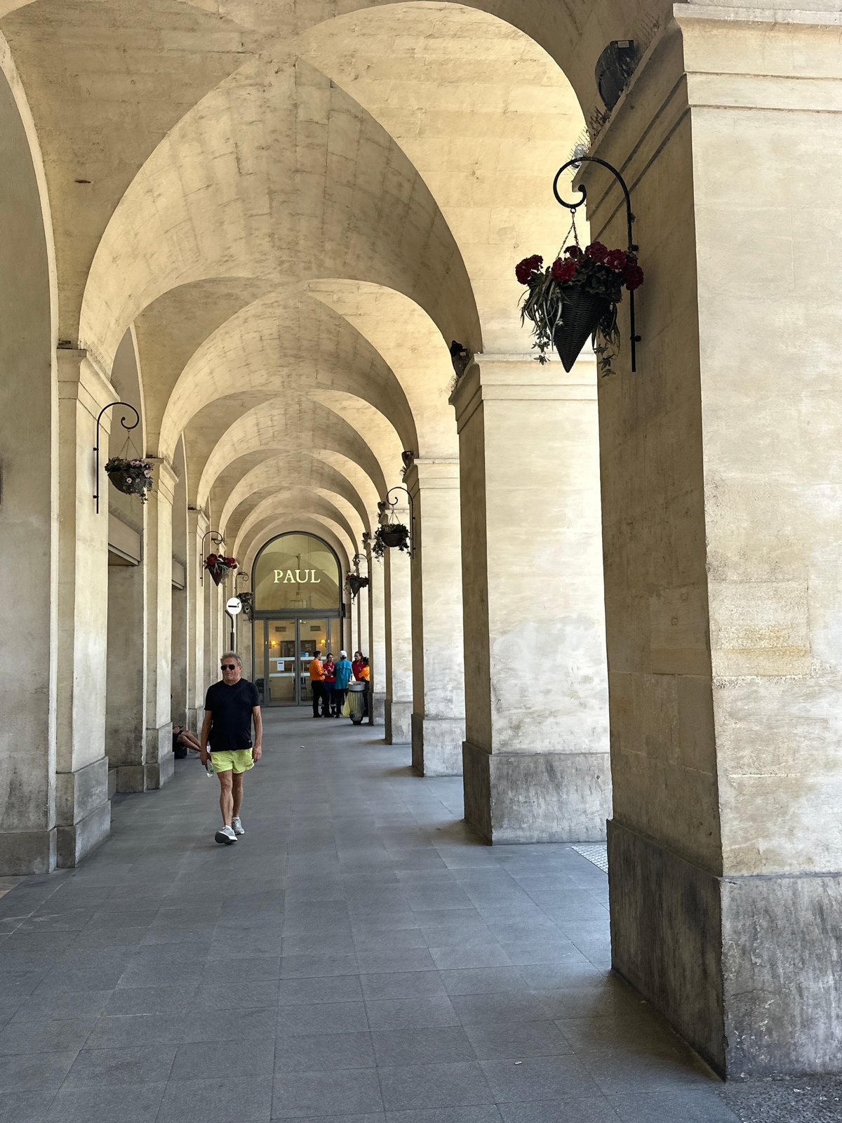 Wandering Nîmes' Roman arcades and stone streets at midday