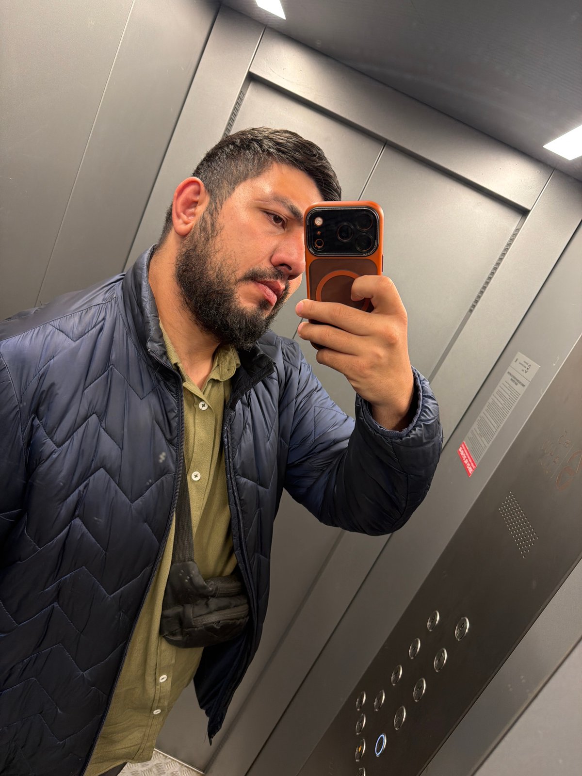 Man takes elevator selfie in Krasnoyarsk, SUV spotted nearby