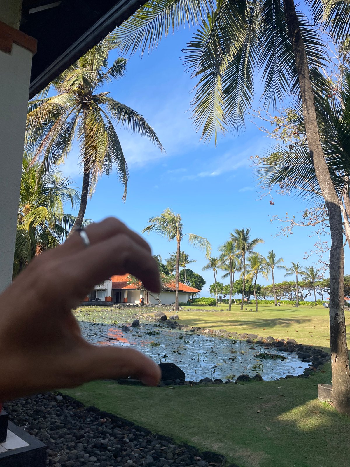 Bali resort grounds and beach on a quiet tropical morning