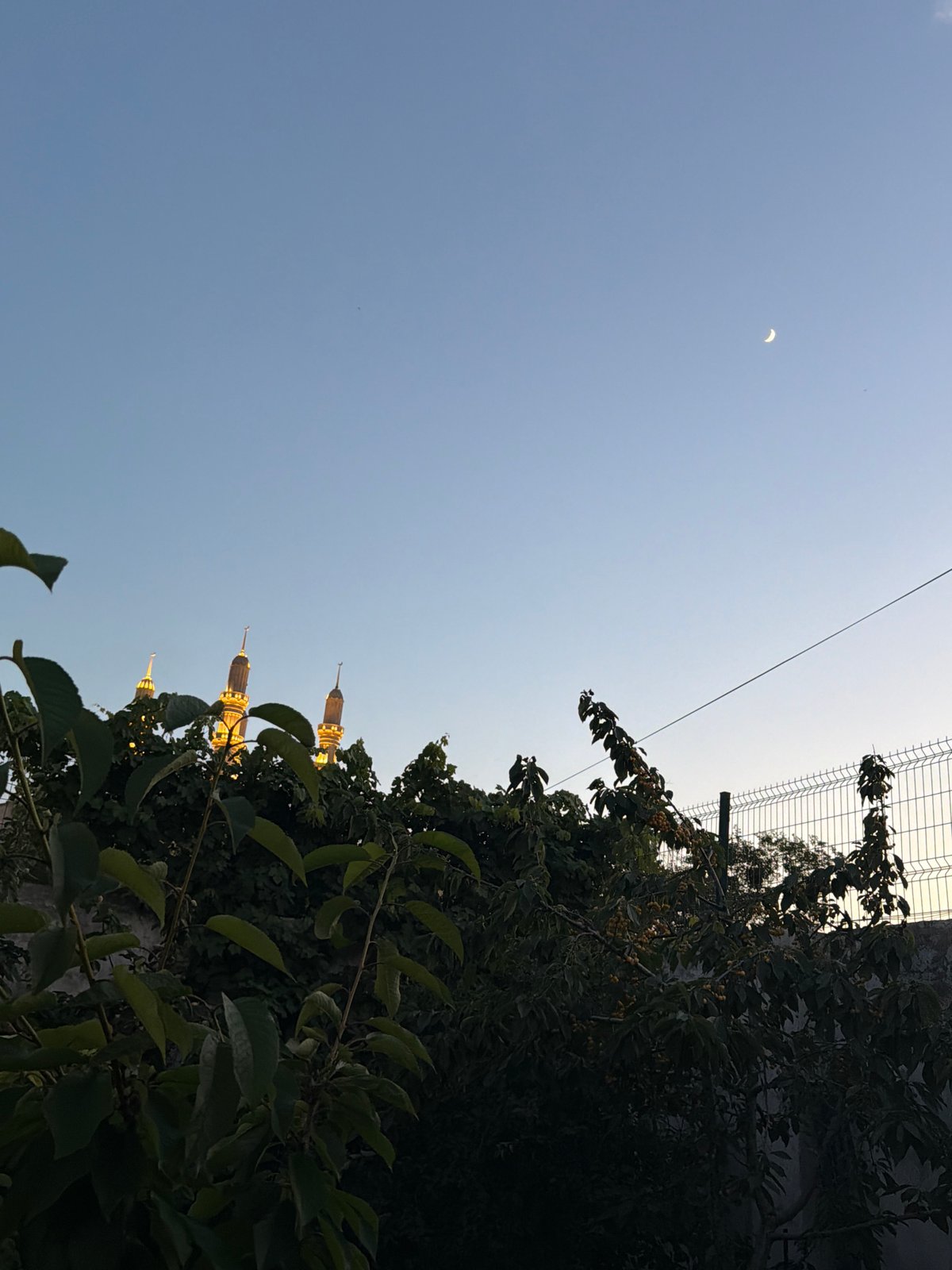 Crescent moon evening with garden scenes and mosque minarets