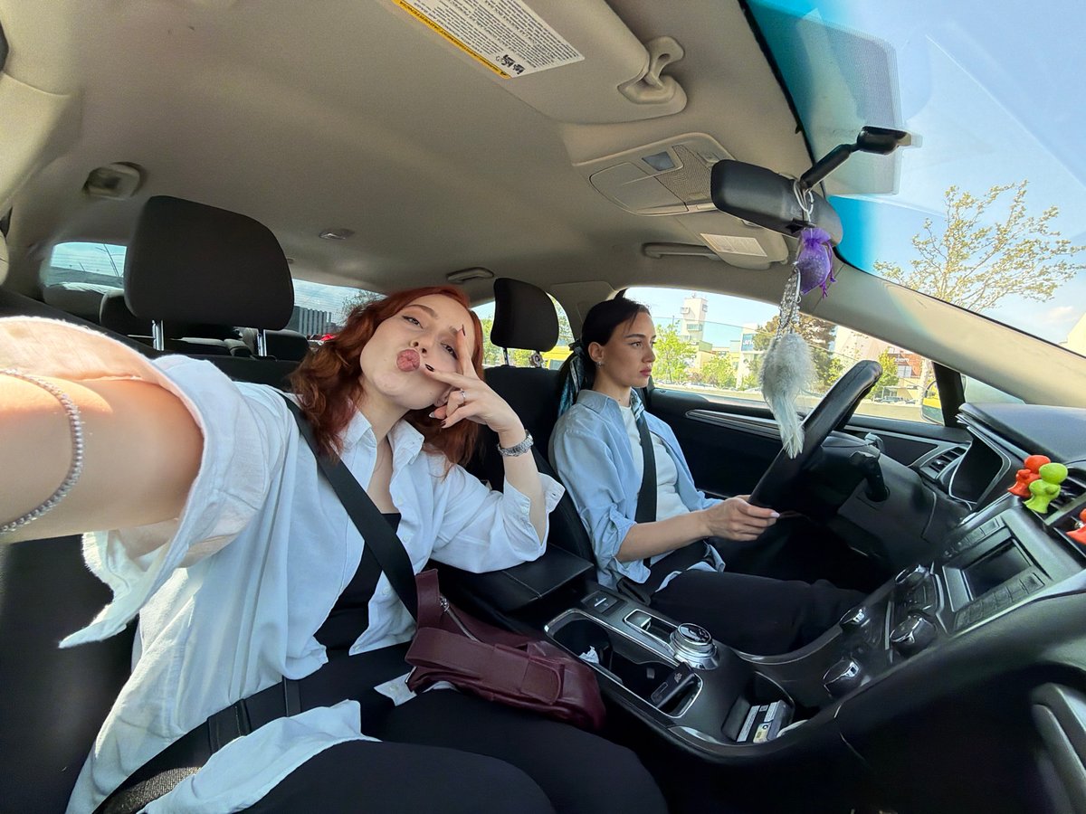 Two women photographed in car during daylight in Tbilisi