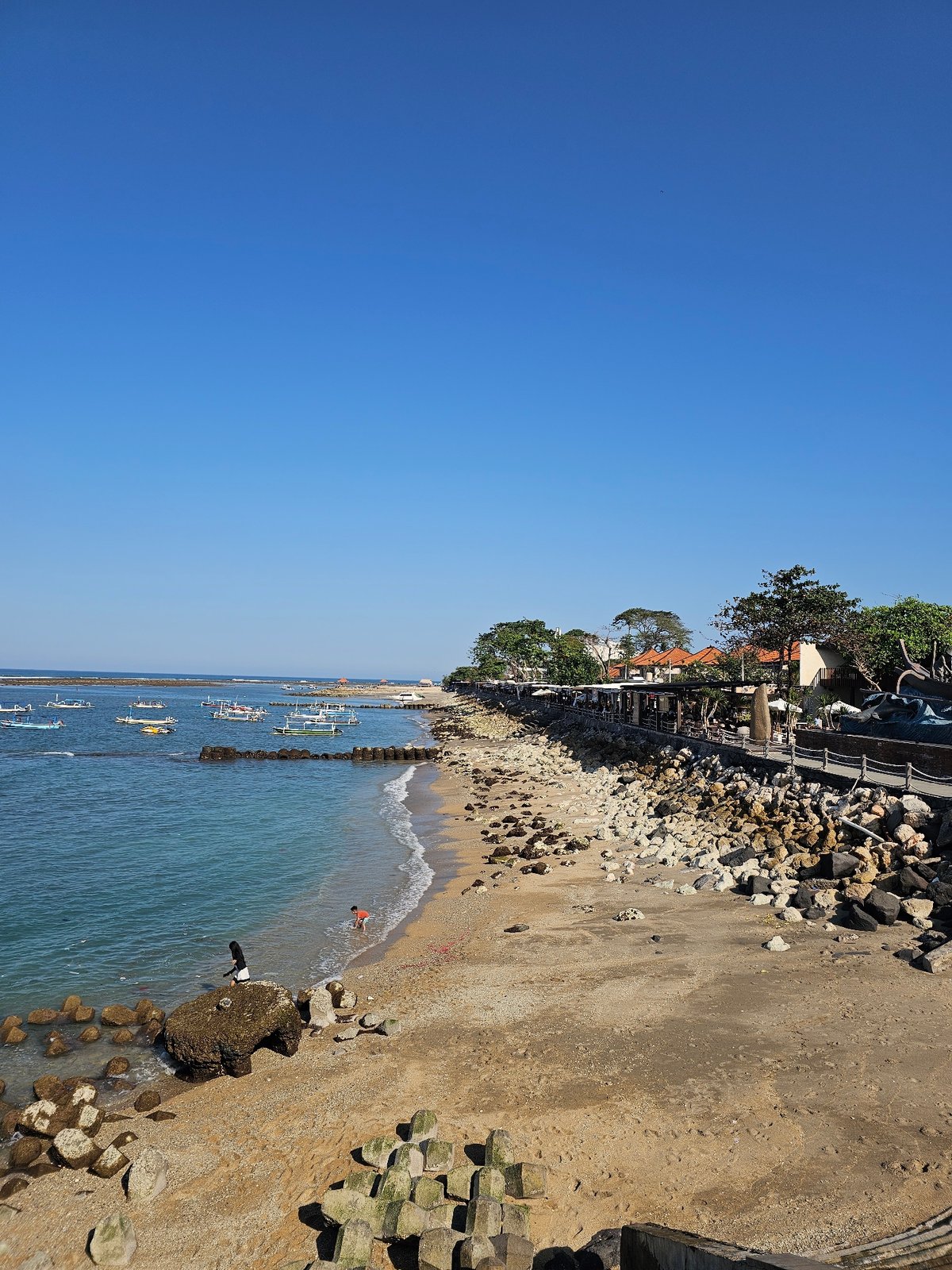 Sanur Beach life: anglers, temples, boats, and beachfront cafes