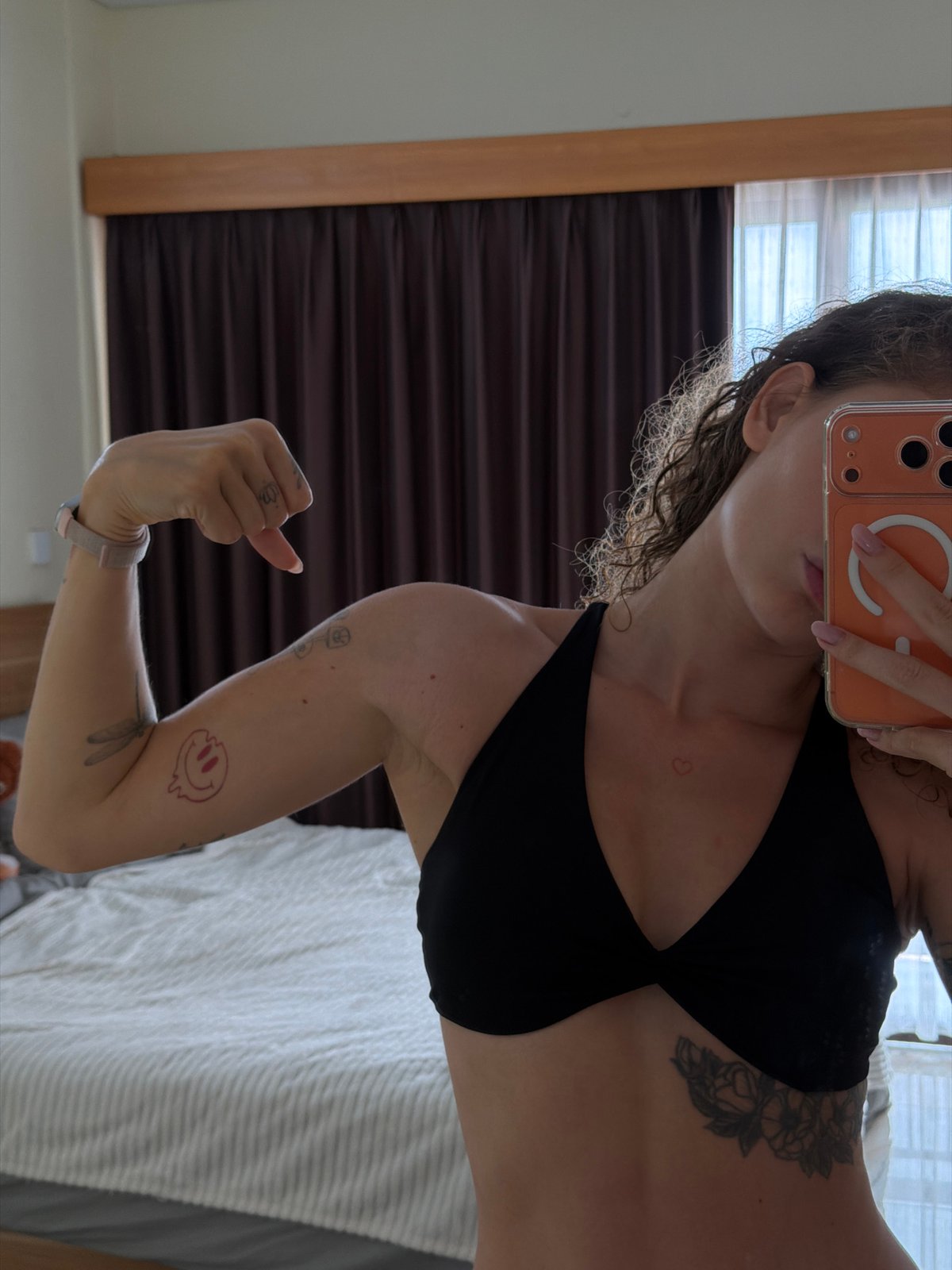 Woman takes multiple mirror selfies in North Kuta bedroom