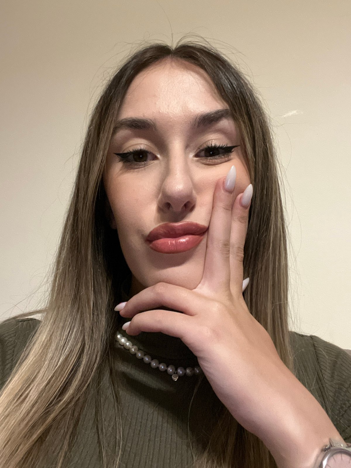 Woman takes indoor selfie portraits in Sofia, Bulgaria