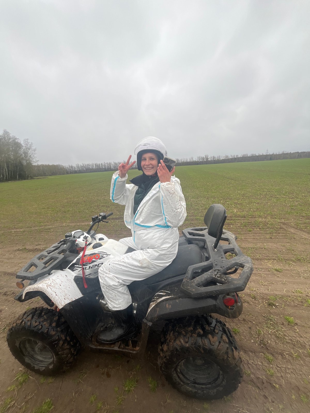 ATV riders navigate muddy terrain in Russian countryside