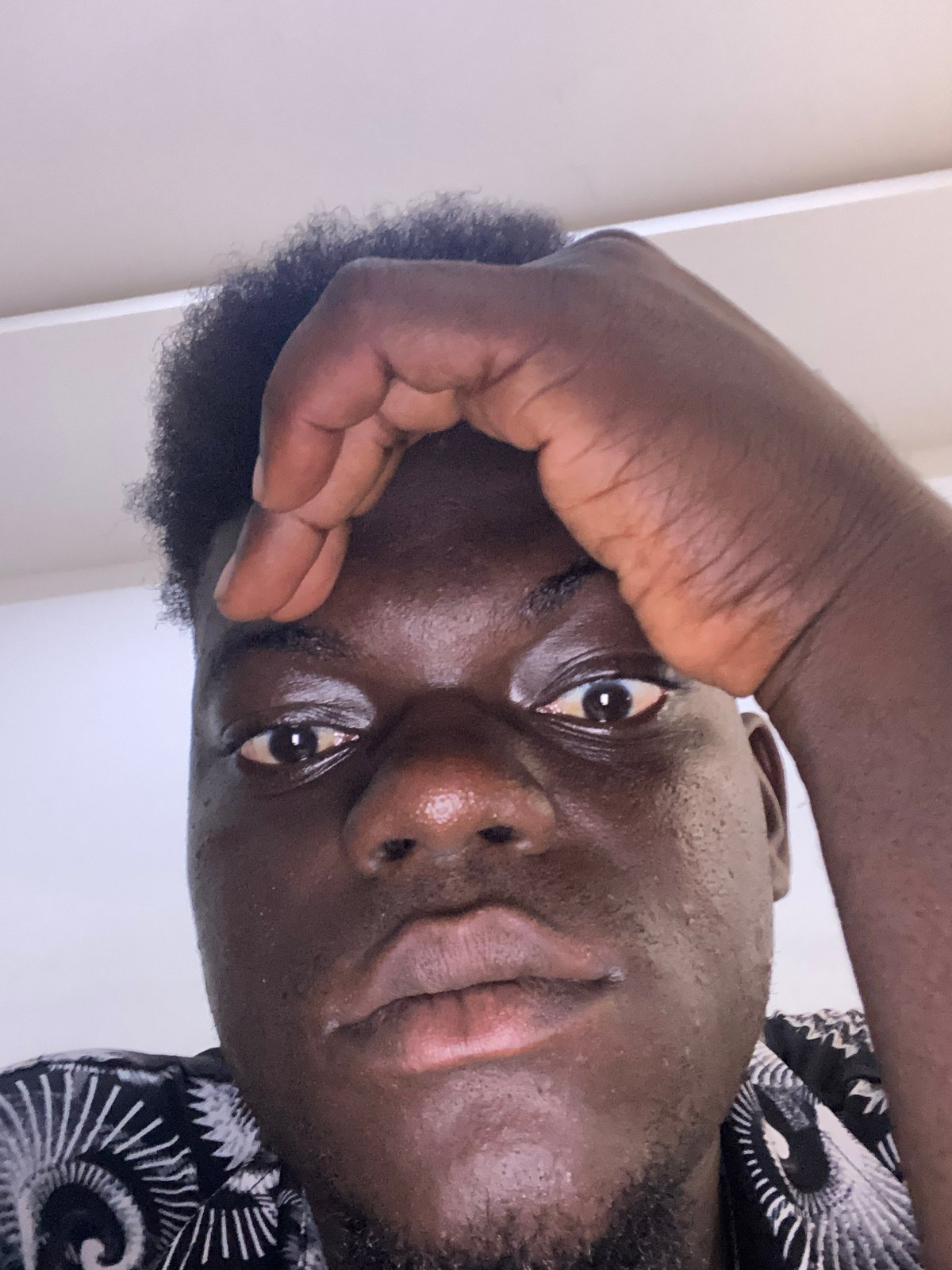 Young man documents himself in production space with equipment