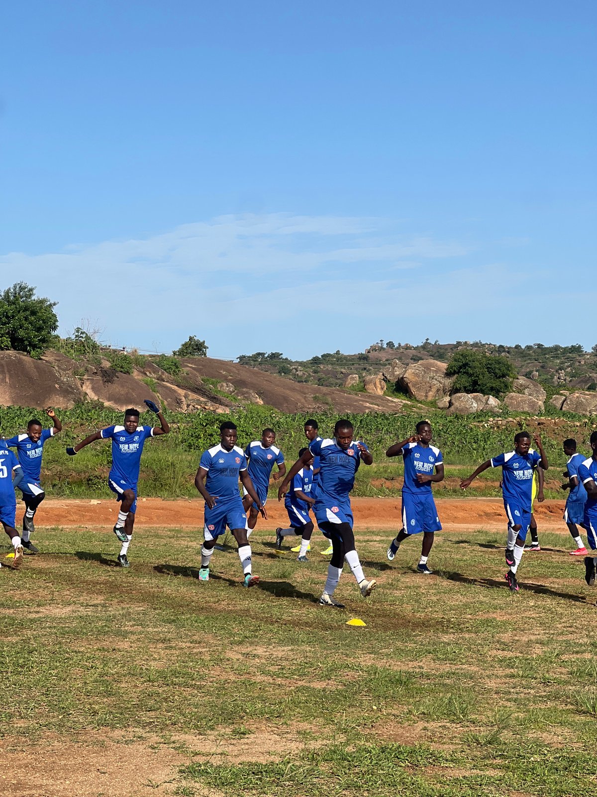 New Hope Academy football squad trains on a Jos field