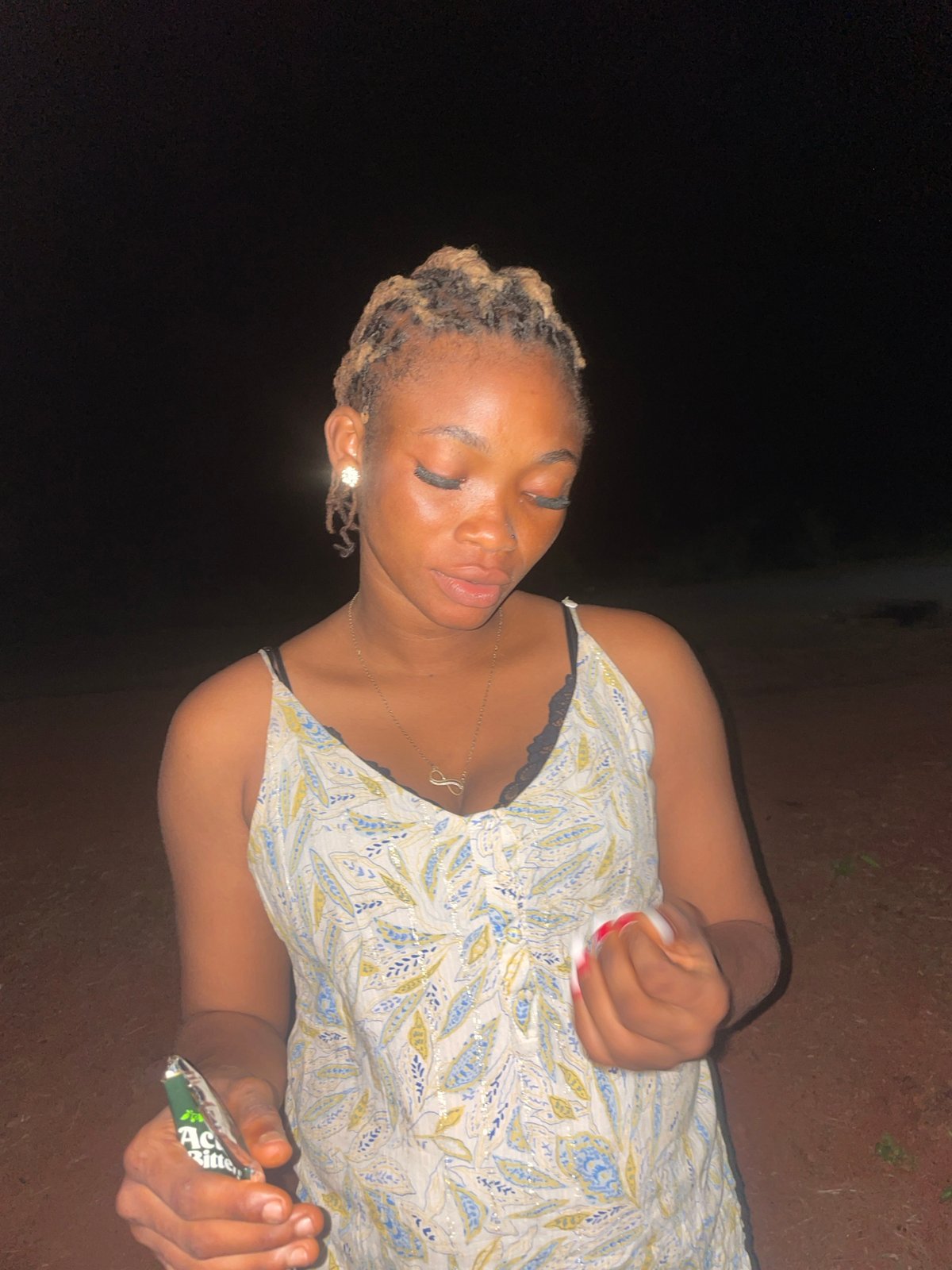 Evening gatherings documented in dimly lit Ogbe, Nigeria