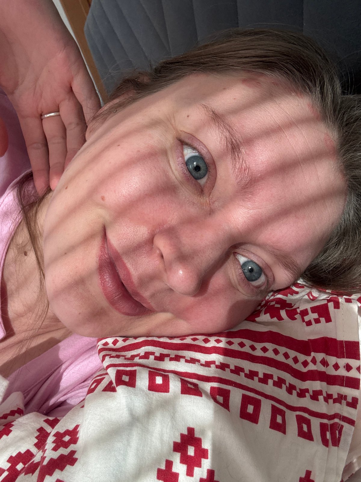 Person photographed resting on patterned pillow in Izhevsk