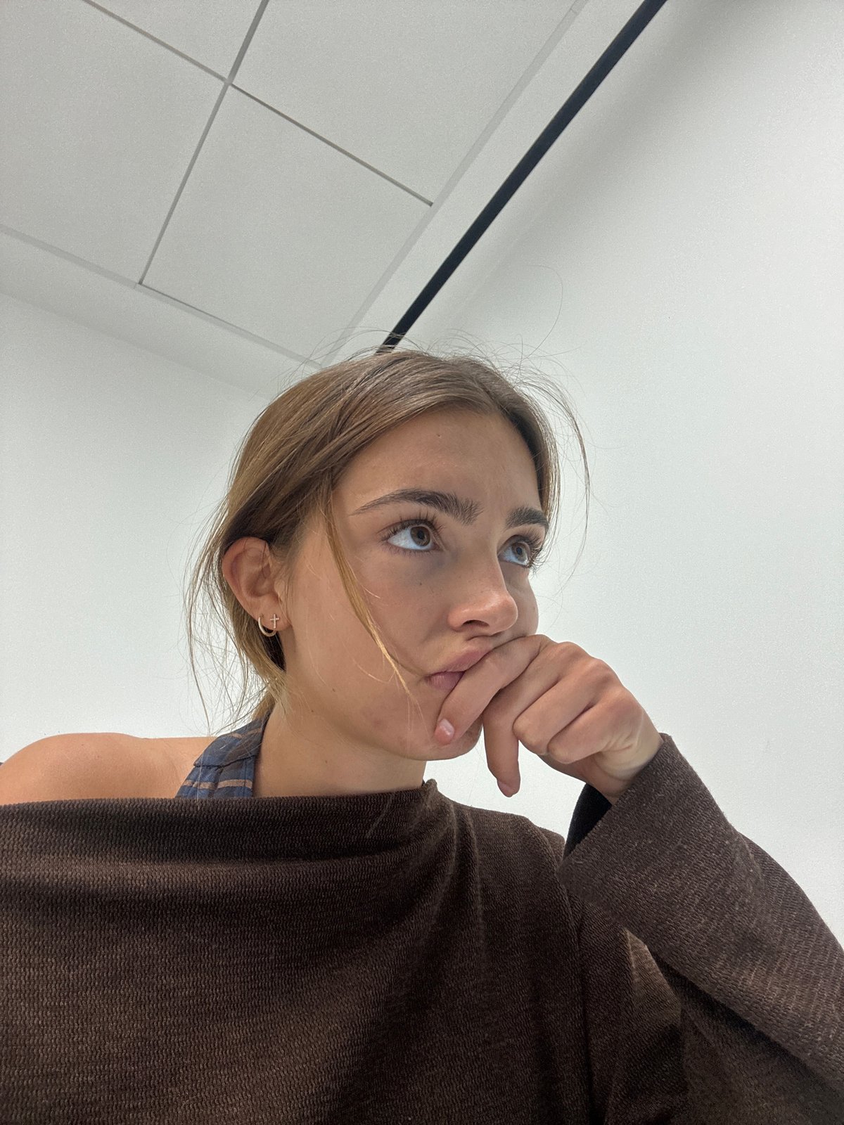 Woman in contemplative indoor moments captured in Torres Vedras