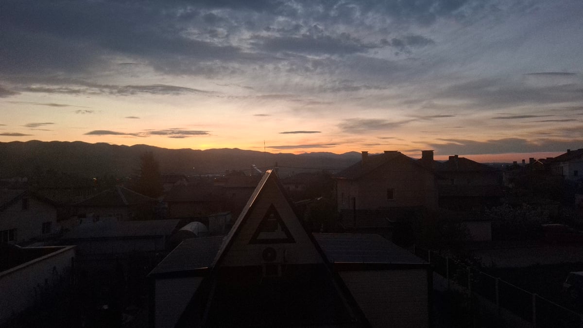 Dawn landscape captured over residential rooftops in Novi Iskar