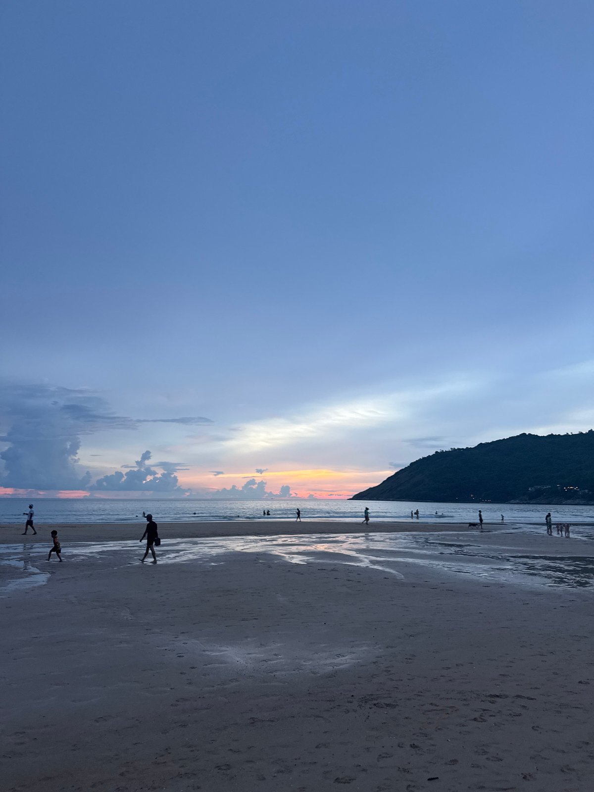 A full day at a tropical beach, rocks to sunset