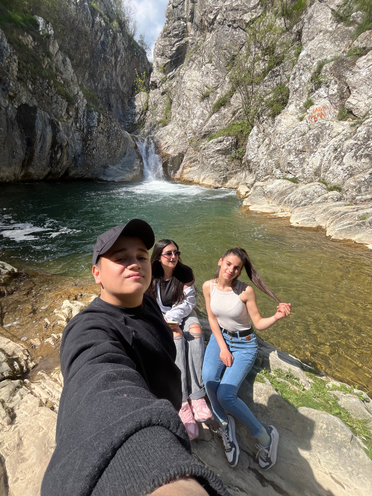 Tourists visit waterfall near Medven, Bulgaria for hiking and photos