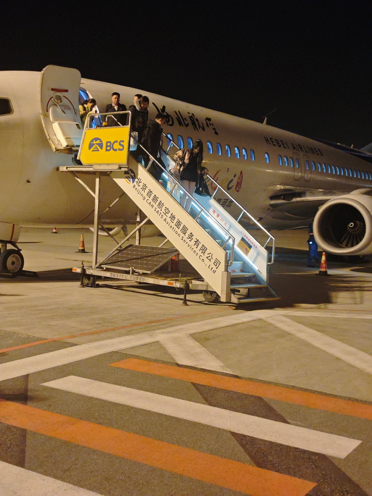 Passengers disembark Hebei Airlines flight in Langfang, China